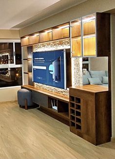 a living room with a large flat screen tv mounted to the side of a wall