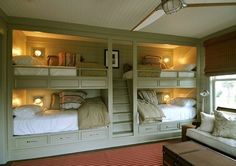 the bunk beds are all made up and ready for someone to use them in their home