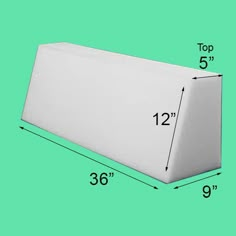 a large white box with measurements for the top and bottom side, on a green background