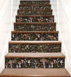 the stairs are decorated with wallpaper and decorative designs, including mushroom - like mushrooms