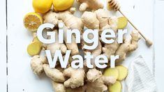 ginger water with lemons, ginger and honey on white background text reads ginger water