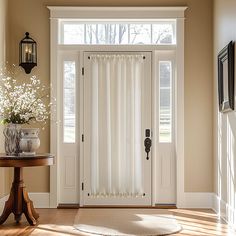 a room with a table, lamp and white curtains on the windowsill in front of a door