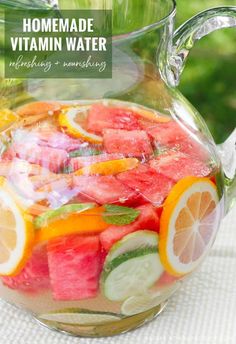 a pitcher filled with watermelon and lemon slices