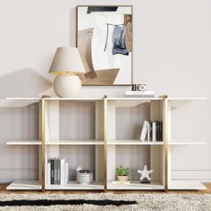 a white bookcase with books and a lamp on top