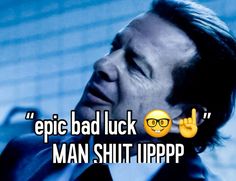 a man in a suit and tie with the words epic bad luck on his face