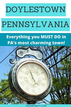 a clock on the side of a pole with trees in the background and text that reads, doylestown pennsylvania everything you must do in pa's most charming town