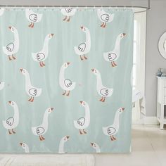 a shower curtain with ducks on it