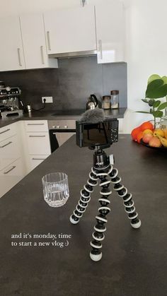 a tripod sitting on top of a kitchen counter