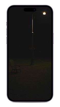 an image of a bench in the dark at night with a street light shining on it