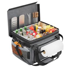 an open cooler bag filled with lots of food and condiments on top of it