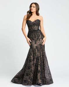 Featuring a stunning sweetheart neckline and flattering trumpet silhouette, this gown is the perfect choice for your special occasion. The intricately beaded waist detail adds a touch of glamour, while the embellished lace fabric adds a beautiful texture. Elevate your look with this elegant and sophisticated gown. Mac Duggal Embellished Lace Overlay; 100% polyester lining Fully lined Strapless sweetheart neckline Sleeveless Corset Beaded waist detail Trumpet silhouette Concealed back zipper Appr Corset Mermaid Prom Dress, Isabelle Drummond, Mac Duggal Prom, Trumpet Silhouette, Sheer Corset, Pageant Gown, Beaded Embellishments, Mermaid Prom Dress, Trumpet Dress