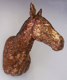 a horse head made out of copper sequins