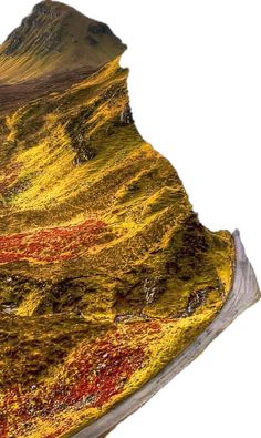 an image of a mountain that looks like it has been painted yellow and red