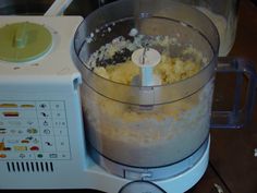 a food processor filled with batter on top of a table