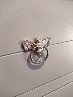 a close up of a door handle with a bee on it