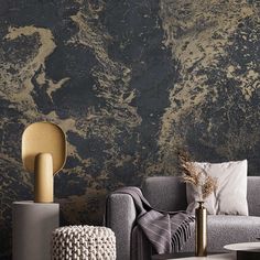 a living room scene with focus on the sofa and wallpaper that looks like marble