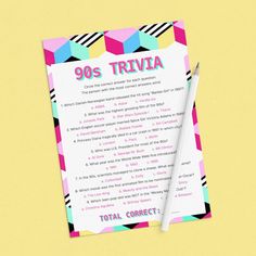 a piece of paper with the words'80s trivia'written on it next to a pencil