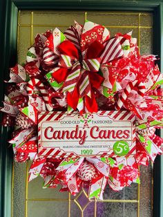 a candy cane wreath hanging on the front door