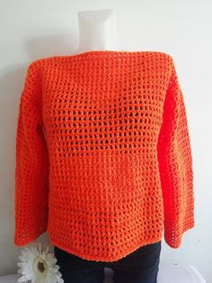 Orange mesh crochet Sweater, Crochet Top, It a lovely colour, looks great with  skirt or trousers Made from Cygnet chunky yarn  Size:          12-14 UK (Medium )          40-42 EU(Medium)            8-10 US (Medium) Loose fitting- across bust: 21" = 42" all around  bust Full length 21" Sleeve length 23" Handmade from Cygnet Chunky yarn Material: 100% Acrylic  Machine warm wash 40oC Hand warm wash 40oC Cold rinse, short spin Do not wring, cool iron Stretch Crochet Long Sleeve Sweater, Mesh Sweater Crochet, Mesh Crochet Sweater, Mesh Crochet Top, Orange Jumper, Orange Jumpers, Mesh Crochet, Mesh Sweater, Crochet Jumper