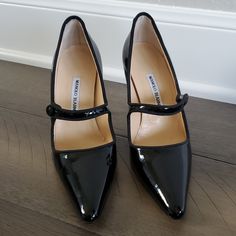 New In Box - Manolo Blahnik Campari Black Patent Leather Mary Jane Heels. Never Worn. Heel Height Is 90mm (3.5 Inches). Pointed Toe. Grosgrain Edging. Front Strap Button Closure. Comes With Box And Dustbag. These Shoes Retail For $825. I Can No Longer Wear This Heel Height So I Am Cleaning Out My Closet. Don't Miss The Opportunity To Own These Fabulous Heels! Manolo Blahnik Mary Jane, Malono Blahnik, Manolo Blahnik Shoes, Jairzinho, Leather Mary Janes, Mary Jane Heels, Carrie Bradshaw, Black Patent Leather, Manolo Blahnik