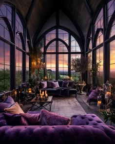 a living room filled with lots of purple furniture