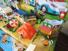 a table topped with lots of toys on top of a wooden floor