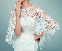 a woman wearing a white wedding dress and holding her hand up to her face with the words overripps for winter weddings