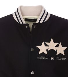 Amiri black Stars Varsity jacket, frontal buttons closure, elasticized on collar, on cuffs and at bottom, lateral zip pockets, frontal patch stars detail, embroidered detail on the front, maxi patch detail on the backComposition: 75% Virgin Wool, 25% Polyamide, 100% Leather, 49% Virgin Wool, 48% Acrylic, 2% Polyamide, 1% Elastane Vacation Wardrobe, Self Portrait Dress, Black Stars, Stella Mccartney Bag, Golden Goose Shoes, Checkered Shirt, Black Star, Sneaker Brands, Black Knit