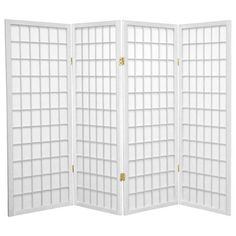 a white room divider with squares on the sides and gold hardwares at the top