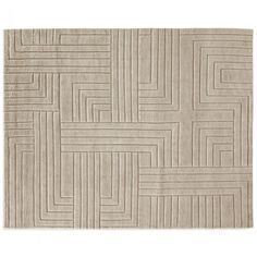 a beige rug with squares and lines on it