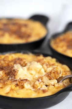 creamy mac and cheese in a skillet with a spoon