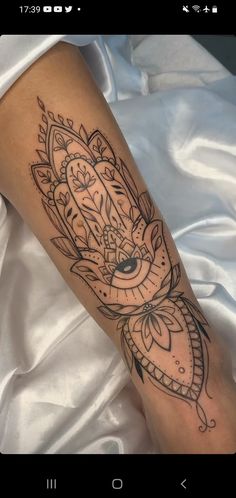 a woman's leg with a tattoo on it and a clock in the middle