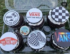 cupcakes decorated with vans and vans off the wall stickers are on display