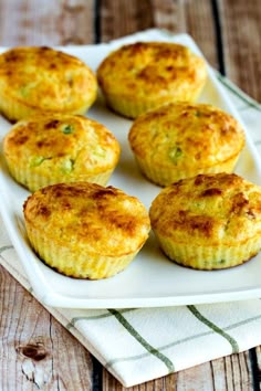 several small muffins on a white plate