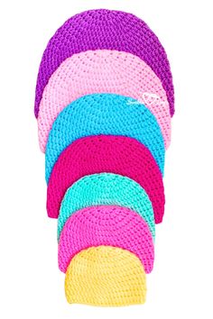 multicolored knitted headbands stacked on top of each other