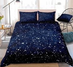 a bed covered in blue and white stars