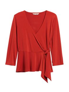 Soft and stretchy, this versatile wrap top is made in our customer-favorite matte jersey fabric.  Bonus: it's super easy to care for - throw it on the washer and dryer, no problem.  V-neck.  Wrap front closure.  Peplum hem.  Fitted - defined waist.  3/4 sleeve.  Short body length - designed for mid-rise and high-rise styles.  Body length (size S): Petite 22. 25", Regular 23. 25" Sleeve length from center back: Petite 26", Regular 26" Model: Size XS, 5'10" (178cm). Versatile Stretch Wrap Top, Versatile Tops With Surplice Neckline And Stretch, Versatile Stretch Tops With Surplice Neckline, Stretch Tops With Surplice Neckline, Versatile Stretch Top With Surplice Neckline, Versatile Wrap Top For Workwear, Versatile Stretch Faux Wrap Top, Versatile Faux Wrap Blouse For Fall, Versatile Faux Wrap Blouse For Work