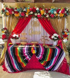 a colorful table with flowers and decorations on it