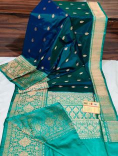 We have a major varieties of colour and design available, but due to heavy demand we may not be able to provide the exact colour and design of your choice instantly. So please inquire before ordering, if the colour of your choice is not available at stock then we will provide you with different designs with similar colour combination. Pure Banarasi Silk Saree with Silk Mark Certificate - Handwoven Elegance Wrap yourself in timeless elegance with our exquisite Pure Banarasi Silk Saree, meticulously handwoven by skilled artisans. Crafted with utmost care and adorned with intricate designs, this saree embodies the rich heritage of Banaras. Each thread tells a story of tradition and craftsmanship, showcasing the finest quality silk that Banarasi sarees are renowned for. The saree comes with an Silk Saree Colour Combinations, South Indian Bride Jewellery, Saree Pins, Indian Brides Jewelry, Designer Sari, Blue Silk Saree, Simple Saree Designs, New Saree Designs, Banarsi Saree