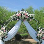 a wedding arch decorated with white and pink flowers