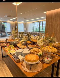 a buffet table filled with many different types of food and desserts on top of it