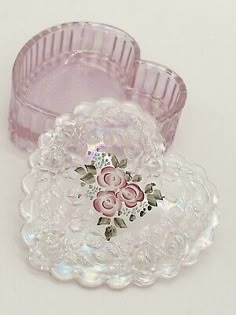 two pink glass dishes sitting on top of each other