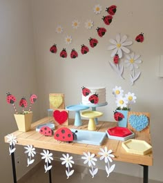 a table topped with lots of different types of cakes and cupcakes on top of it