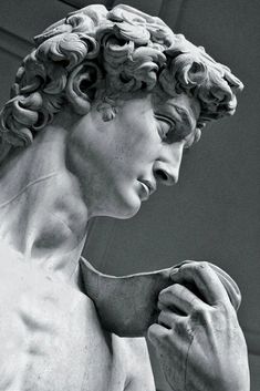 black and white photograph of a statue holding a bowl