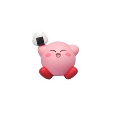 a pink toy with a black and white ball on it's head, sitting in front of a white background