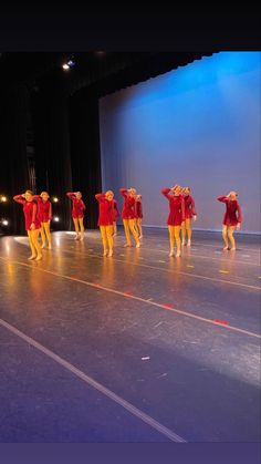 a group of people standing on top of a stage