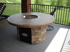 a fire pit sitting on top of a wooden deck