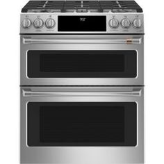 two stainless steel ovens side by side with the top open and bottom closed, on an isolated white background