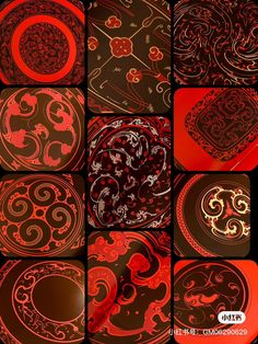 some red and black plates with designs on them