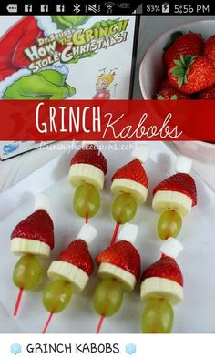 a bunch of fruit skewers with santa hats on them